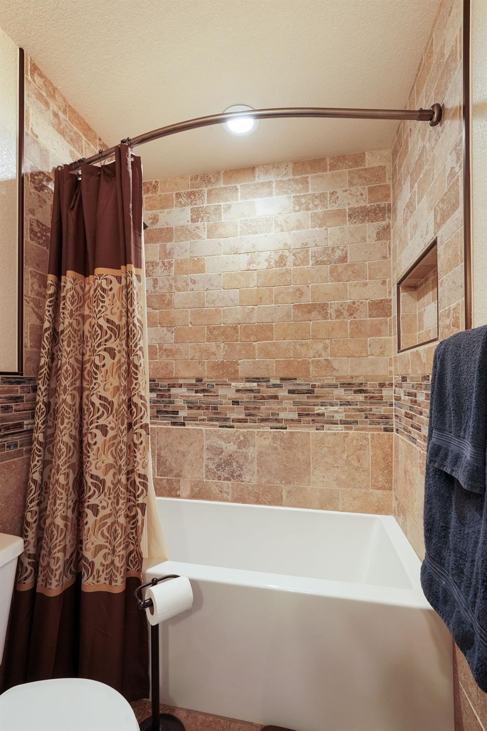 764 Adare Way Galt, CA 95632 - Photo 22 of 59 a bathroom with a shower curtain and a sink
