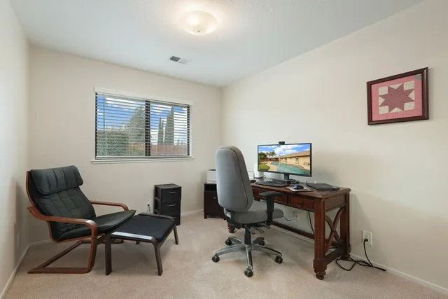 a view of a swimming pool with a sitting space