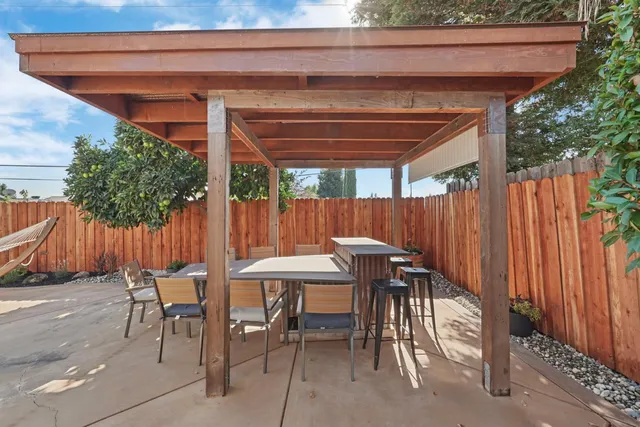 a view of a patio with chairs and tables