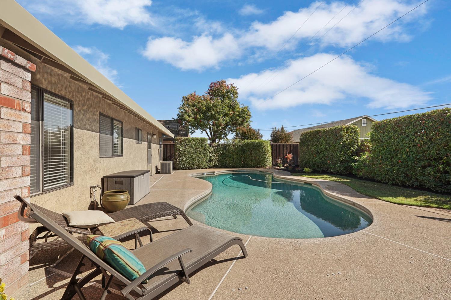 764 Adare Way Galt, CA 95632 - Photo 41 of 59 a view of a swimming pool with a lounge chair