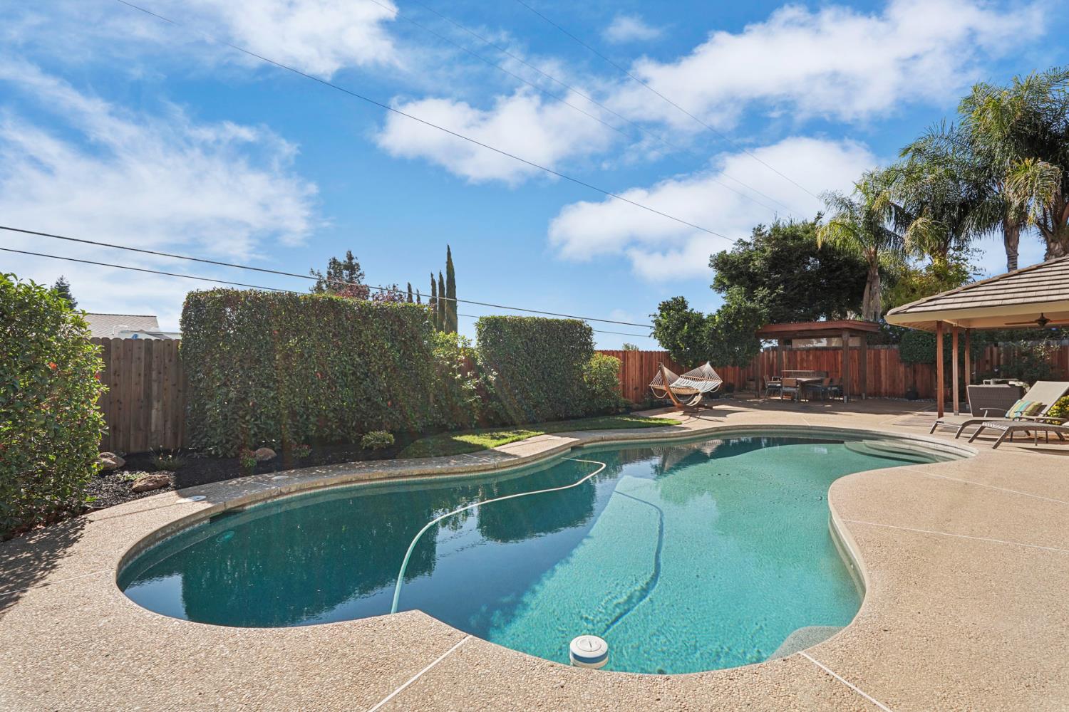 764 Adare Way Galt, CA 95632 - Photo 42 of 59 a view of a swimming pool with a sitting space