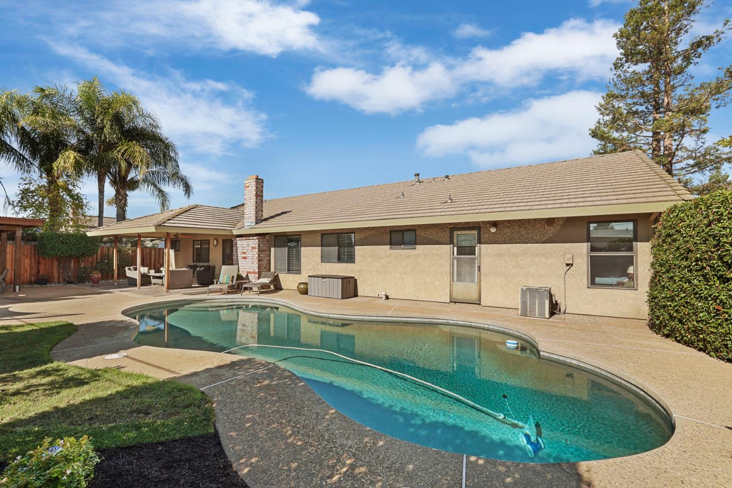 764 Adare Way Galt, CA 95632 - Photo 43 of 59 a front view of a house with swimming pool having outdoor seating