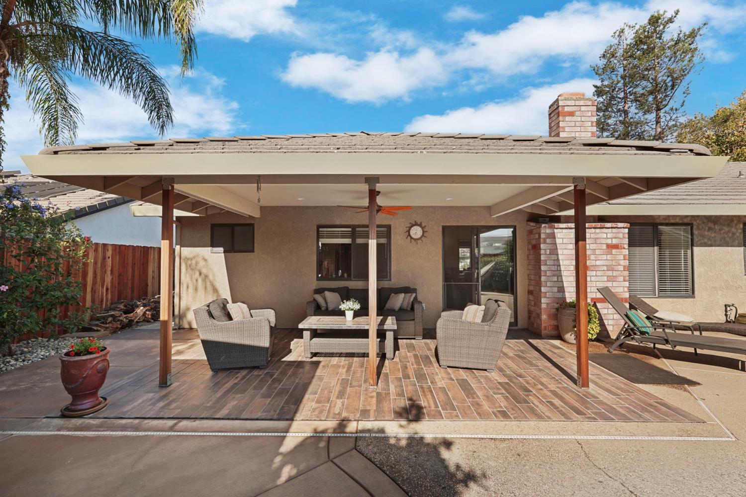 764 Adare Way Galt, CA 95632 - Photo 45 of 59 a view of a patio with couches table and chairs and potted plants