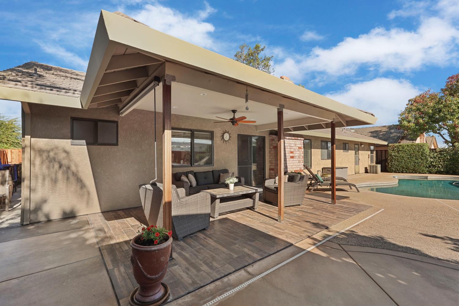 764 Adare Way Galt, CA 95632 - Photo 47 of 59 a view of a patio with dining table and chairs with wooden floor