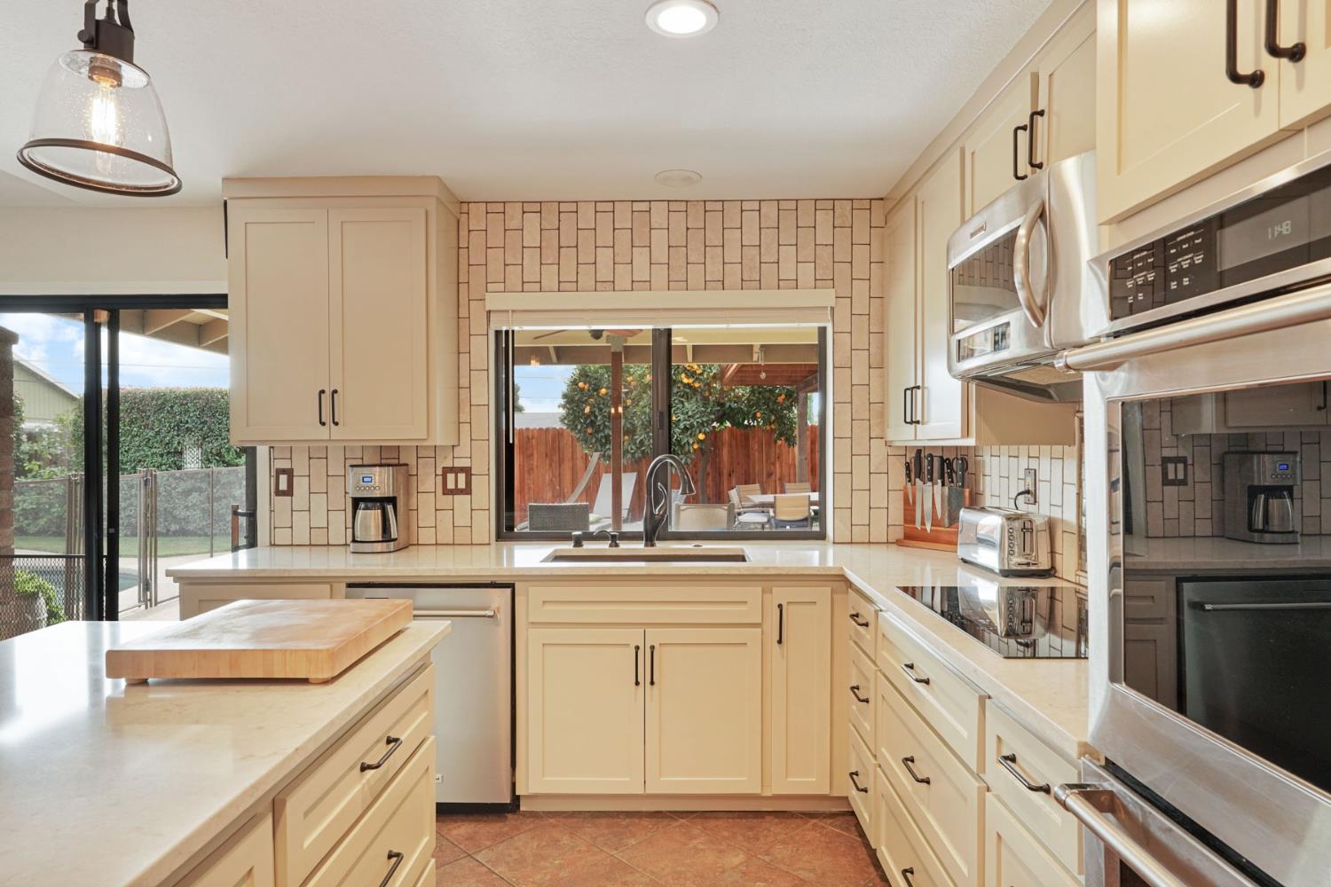 764 Adare Way Galt, CA 95632 - Photo 7 of 59 a kitchen with white cabinets and white appliances