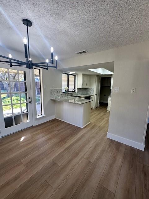 401 Willow Way Wylie, TX 75098 - Photo 6 of 19 a kitchen with stainless steel appliances wooden floor and a view of living room