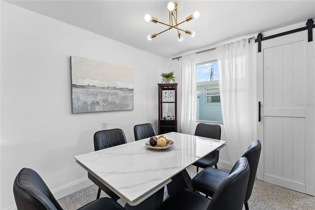 13313 2nd Street East Madeira Beach, FL 33708 - Photo 14 of 36 a view of a dining room with furniture