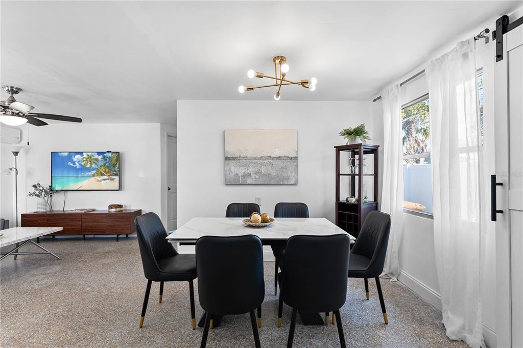 13313 2nd Street East Madeira Beach, FL 33708 - Photo 20 of 36 a view of a dining room with furniture