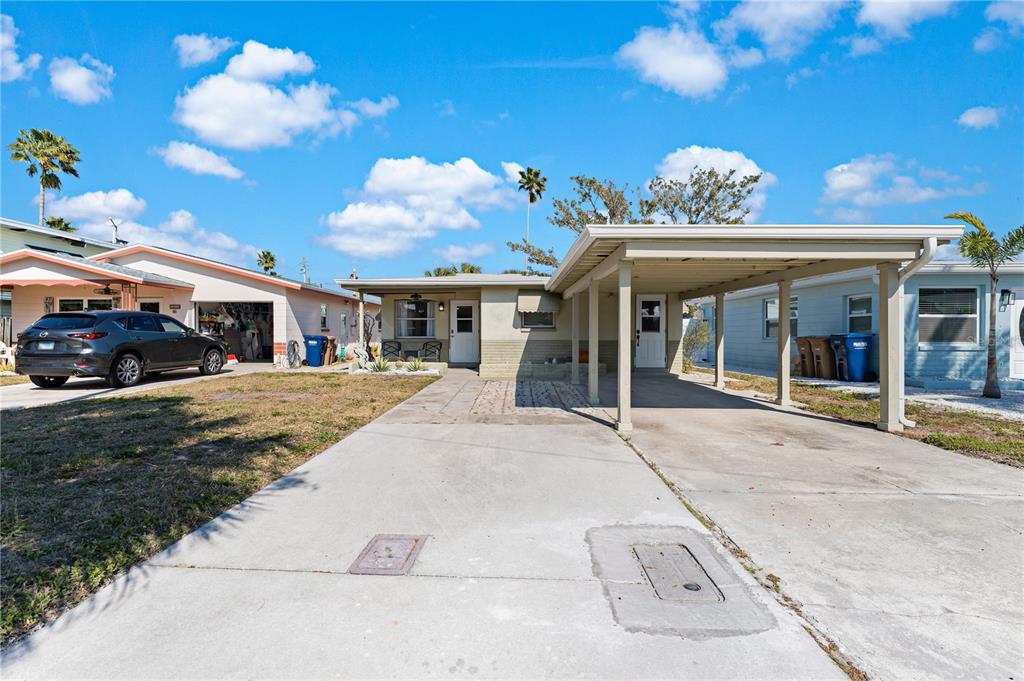 13313 2nd Street East Madeira Beach, FL 33708 - Photo 23 of 36 a view of a house with a porch