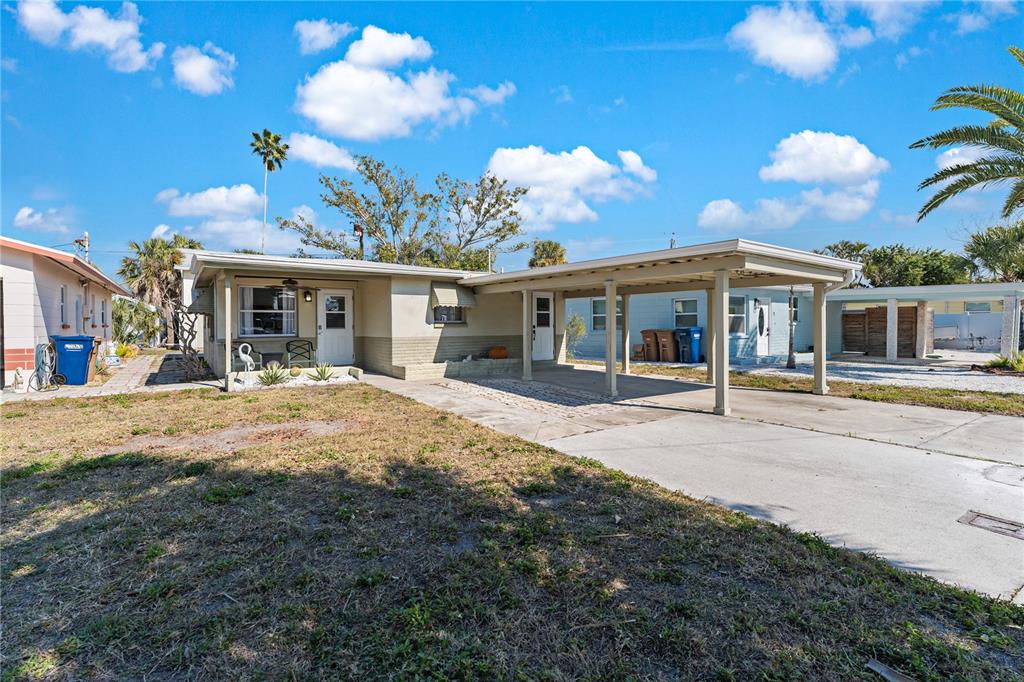 13313 2nd Street East Madeira Beach, FL 33708 - Photo 24 of 36 a view of a house with a patio