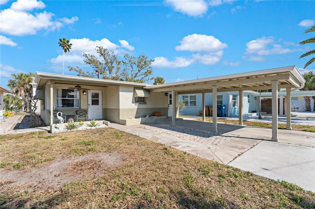 13313 2nd Street East Madeira Beach, FL 33708 - Photo 25 of 36 a view of a house with a patio