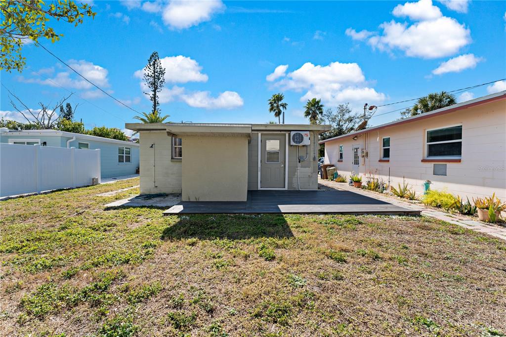 13313 2nd Street East Madeira Beach, FL 33708 - Photo 29 of 36 a front view of house with yard