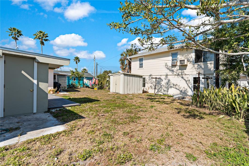 13313 2nd Street East Madeira Beach, FL 33708 - Photo 33 of 36 a view of a house with a tree in the background