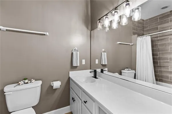a bathroom with a glass shower door