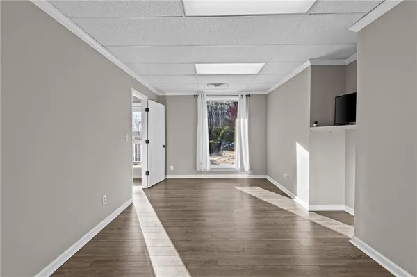 a living room with furniture a fireplace and a table