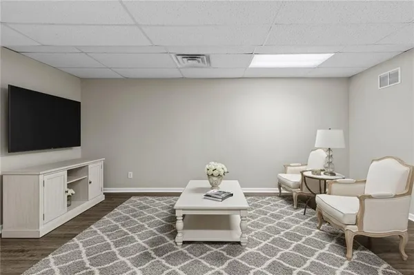 a kitchen with granite countertop a sink cabinets and stainless steel appliances