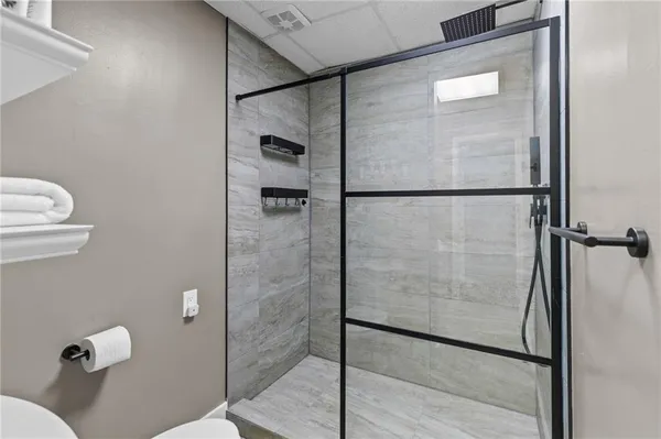 a view of a room with wooden floor and window