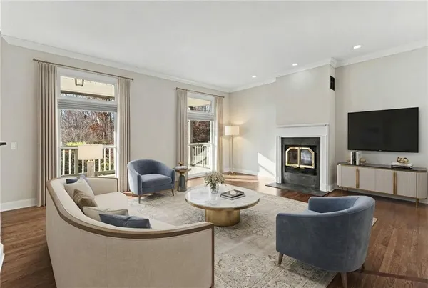 a front view of a house with a garden and lake view