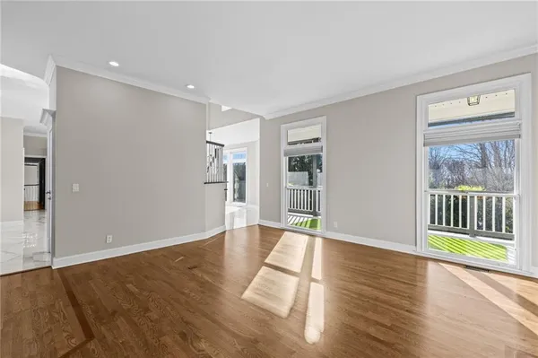 an aerial view of a residential houses with yard