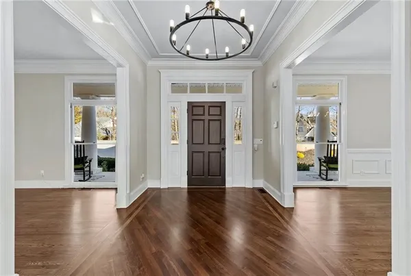 an empty room with a ceiling fan and a window