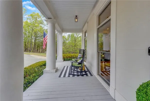 a view of a hallway view with wooden floor and staircase