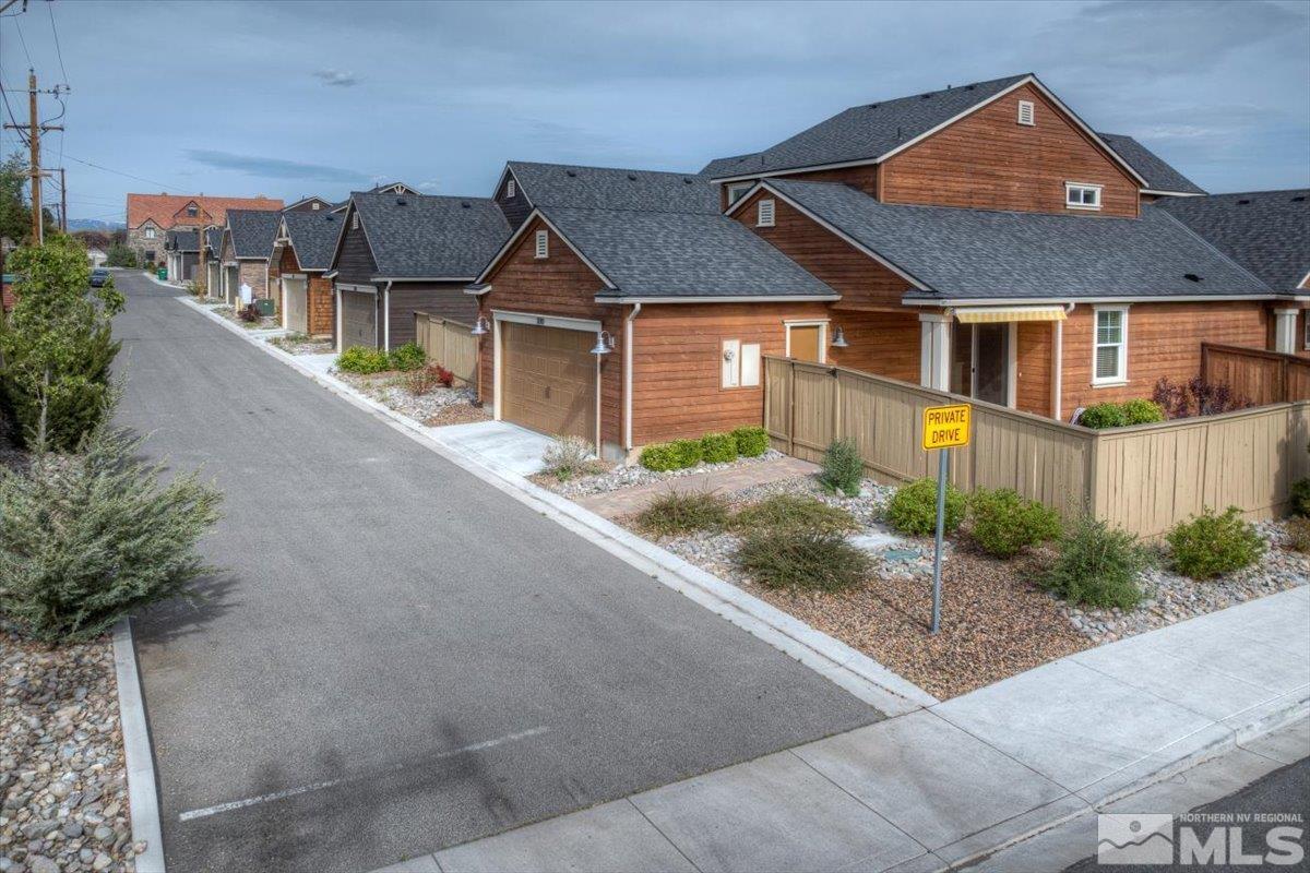 300 Mt Rose Street Reno, NV 89509 - Photo 25 of 26 a front view of a house with a yard and garage