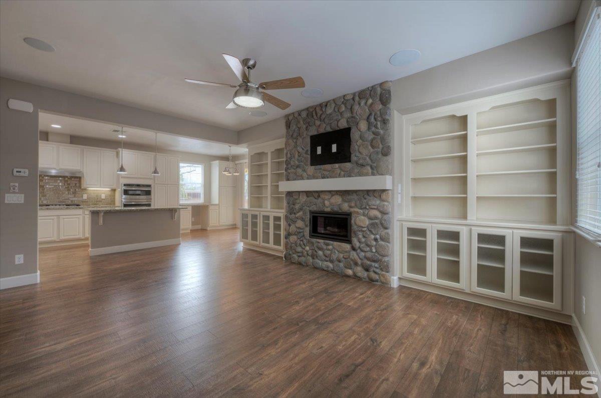 300 Mt Rose Street Reno, NV 89509 - Photo 6 of 26 a view of a living room with wooden floor and a fireplace