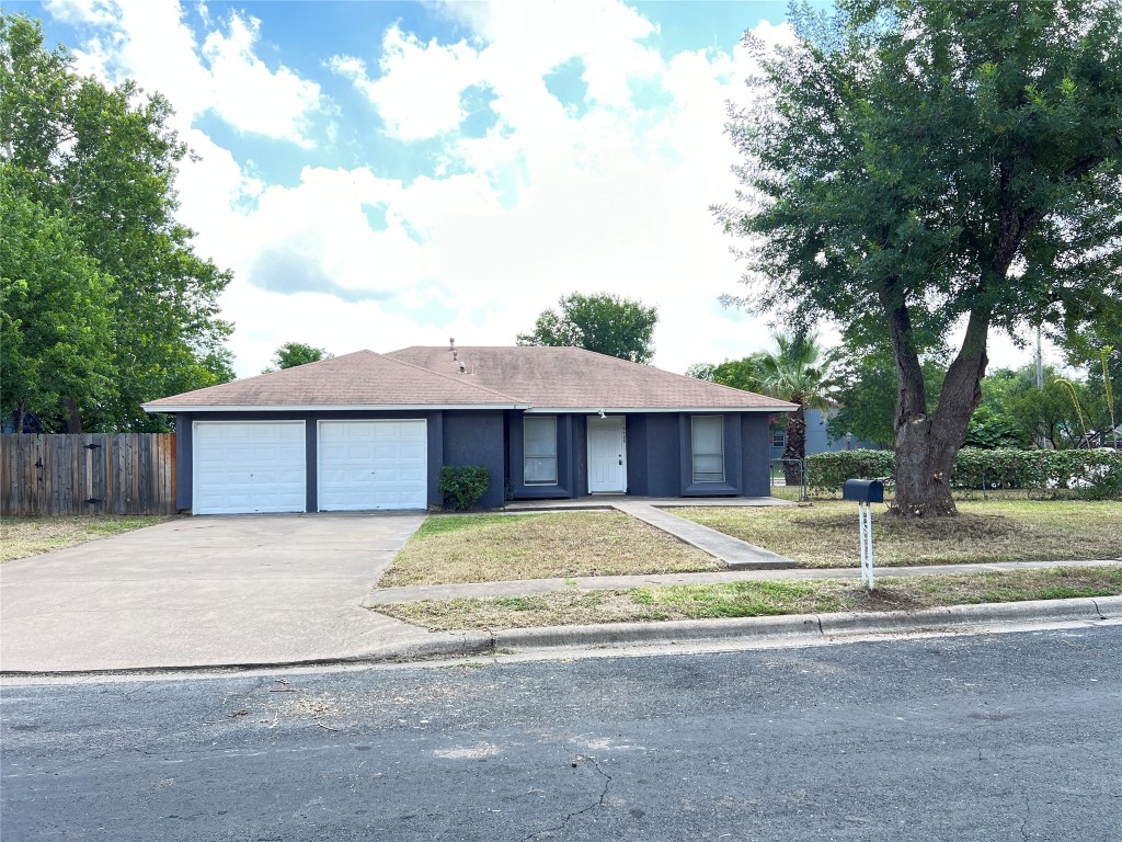 4408 Button Bend Circle Austin, TX 78744 - Photo 1 of 1 a house that has a tree in front of it