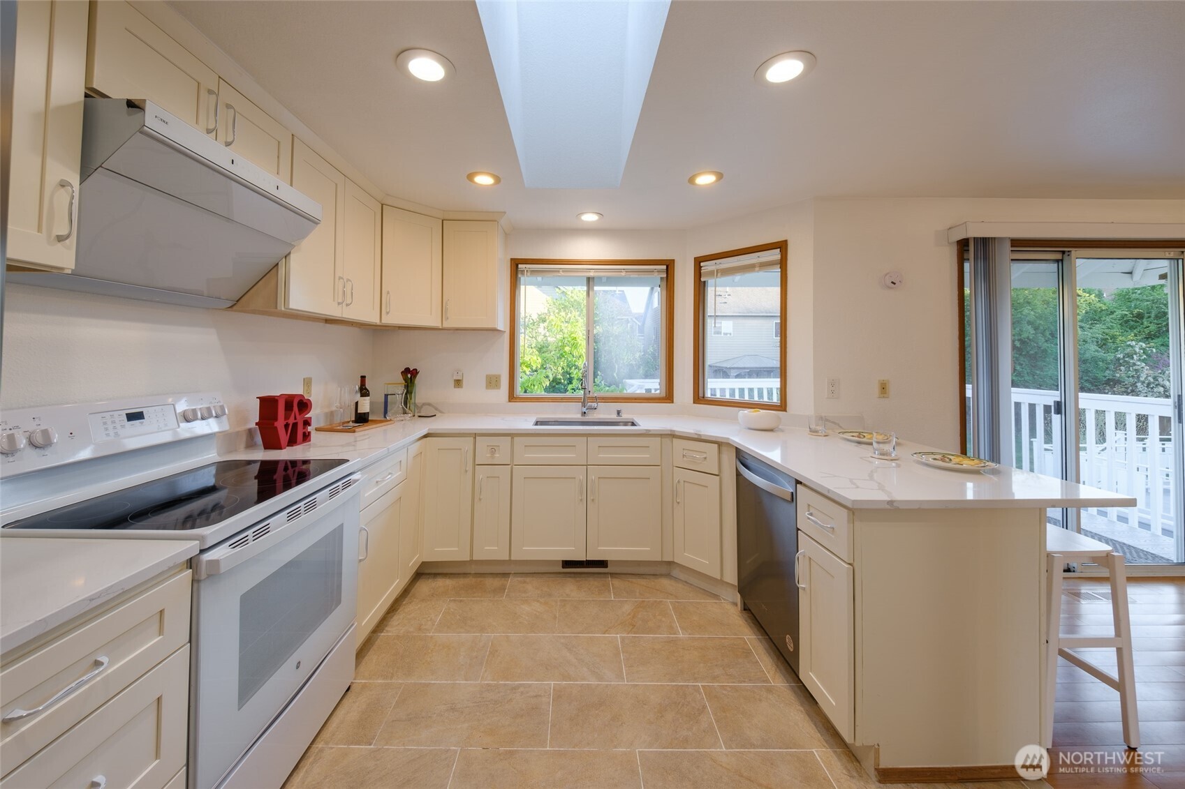 830 234th Street Southeast Bothell, WA 98021 - Photo 6 of 26 a kitchen with a sink window and cabinets