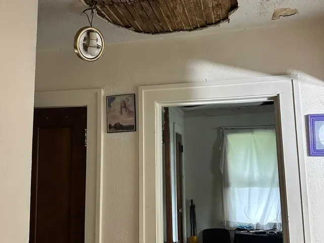 a living room with furniture window and gym equipment