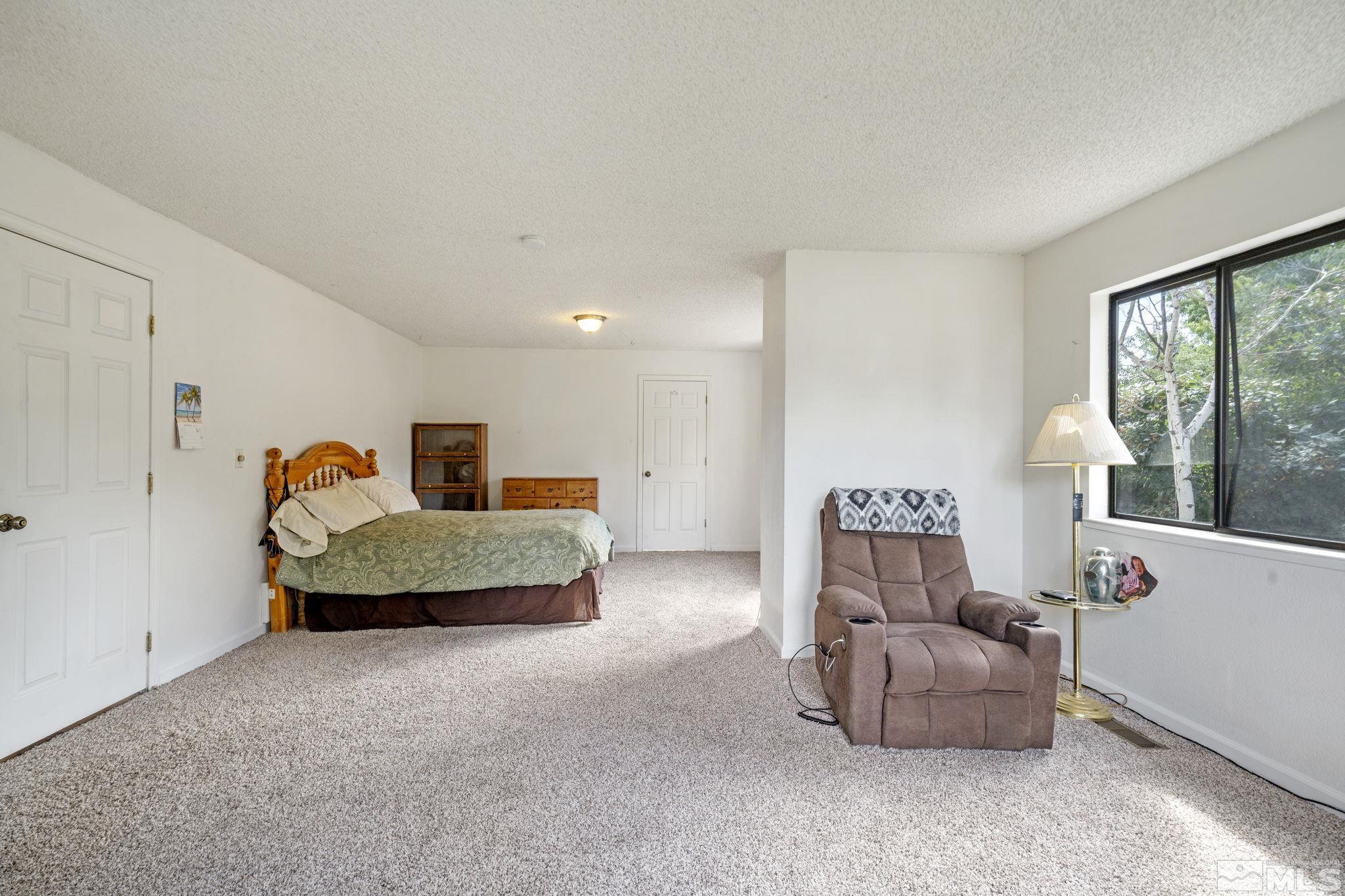 95 Cliff View Drive Reno, NV 89523 - Photo 27 of 39 a living room with furniture and a window