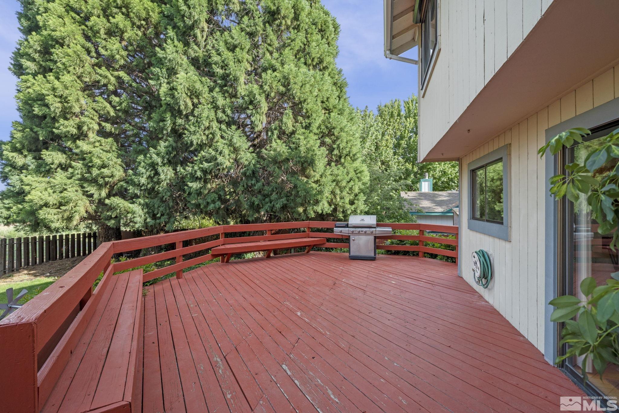 95 Cliff View Drive Reno, NV 89523 - Photo 31 of 39 a backyard of a house with wooden floor and outdoor seating