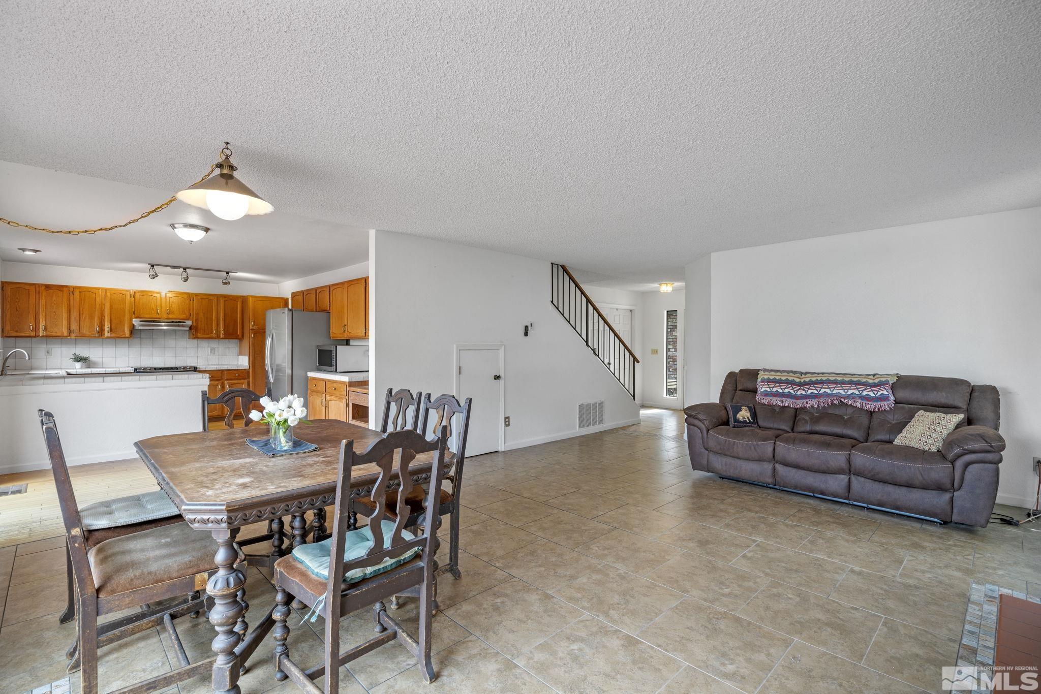 95 Cliff View Drive Reno, NV 89523 - Photo 8 of 39 a living room with furniture and a chandelier