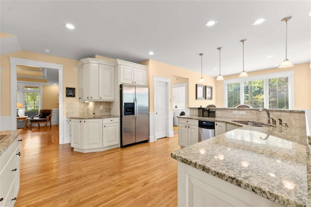 526 Orchard Drive Clarkesville, GA 30523 - Photo 11 of 81 a kitchen with stainless steel appliances granite countertop a refrigerator a sink and a stove