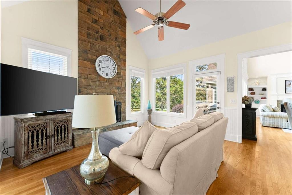 526 Orchard Drive Clarkesville, GA 30523 - Photo 19 of 81 a living room with furniture a rug and a flat screen tv
