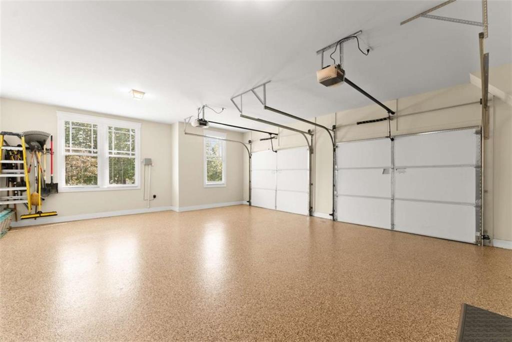 526 Orchard Drive Clarkesville, GA 30523 - Photo 22 of 81 an empty room with wooden floor and windows