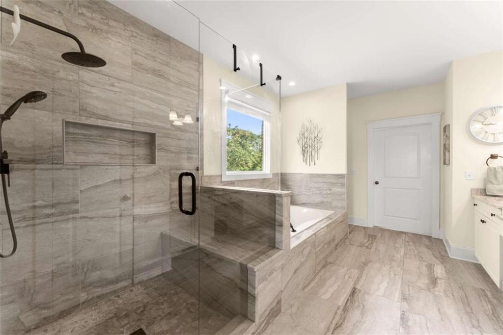 526 Orchard Drive Clarkesville, GA 30523 - Photo 30 of 81 a bathroom with a granite countertop sink a toilet and a shower