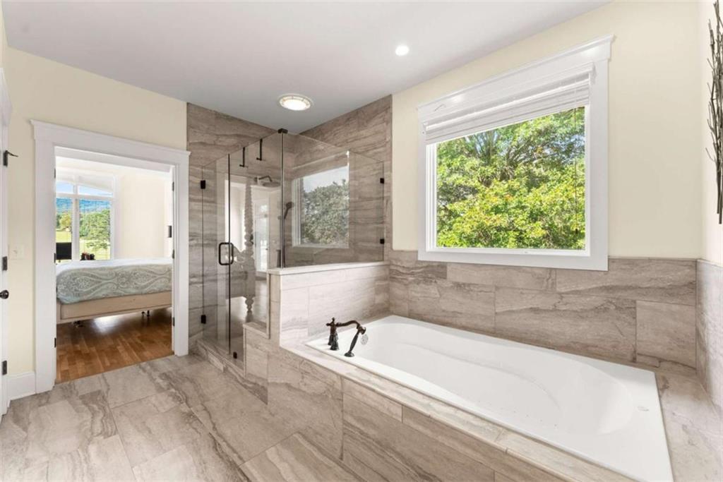 526 Orchard Drive Clarkesville, GA 30523 - Photo 31 of 81 a spacious bathroom with a large tub and shower