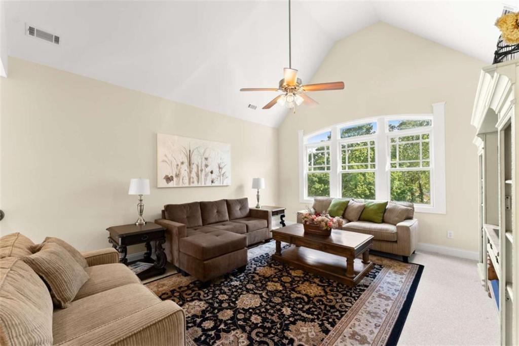 526 Orchard Drive Clarkesville, GA 30523 - Photo 39 of 81 a living room with furniture ceiling fan and a rug