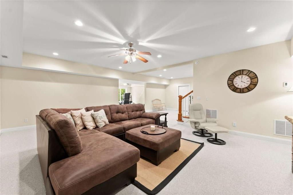 526 Orchard Drive Clarkesville, GA 30523 - Photo 51 of 81 a living room with furniture a rug and a window