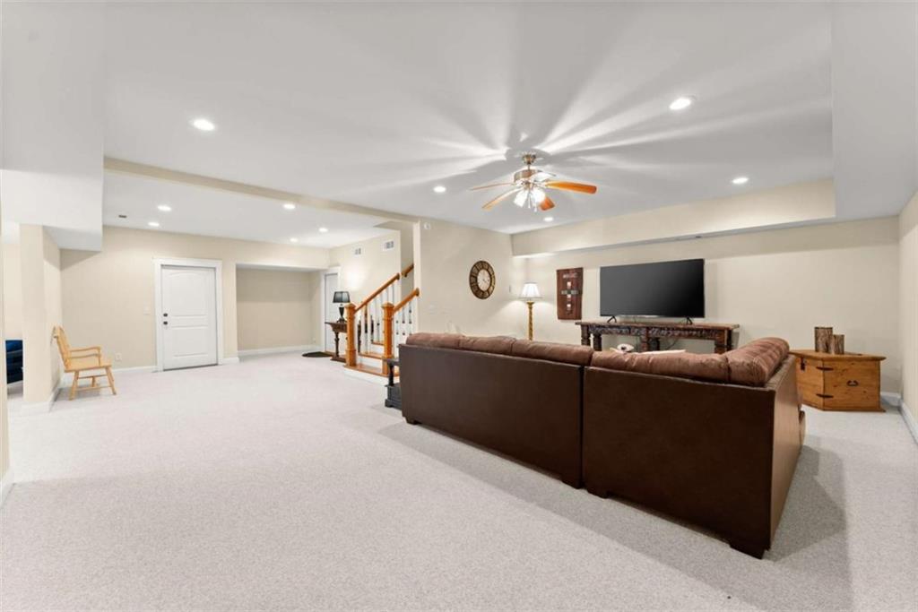 526 Orchard Drive Clarkesville, GA 30523 - Photo 52 of 81 a living room with furniture and a flat screen tv