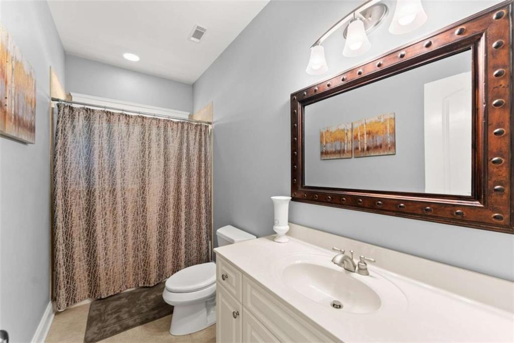 526 Orchard Drive Clarkesville, GA 30523 - Photo 55 of 81 a bathroom with a sink a toilet and shower curtain