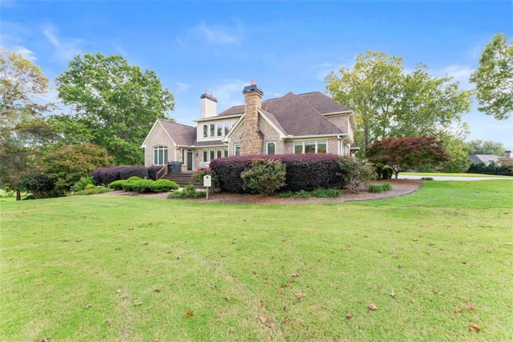 526 Orchard Drive Clarkesville, GA 30523 - Photo 64 of 81 a front view of a house with garden