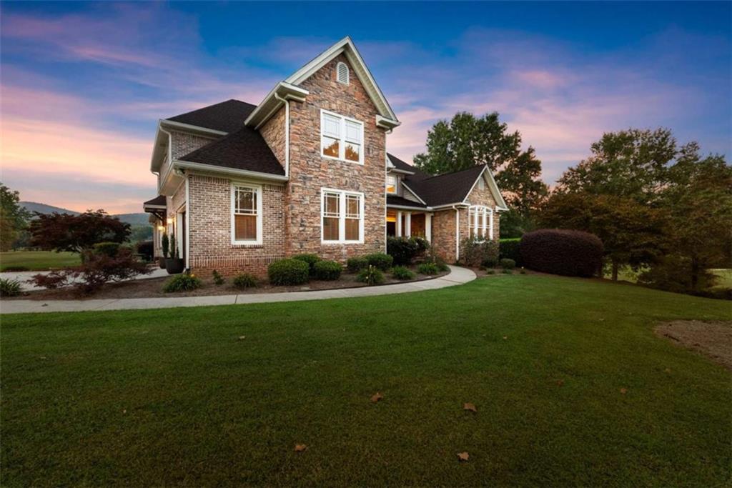 526 Orchard Drive Clarkesville, GA 30523 - Photo 75 of 81 a front view of a house with a garden and trees
