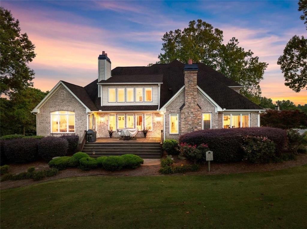 526 Orchard Drive Clarkesville, GA 30523 - Photo 78 of 81 a front view of a house with a garden and plants