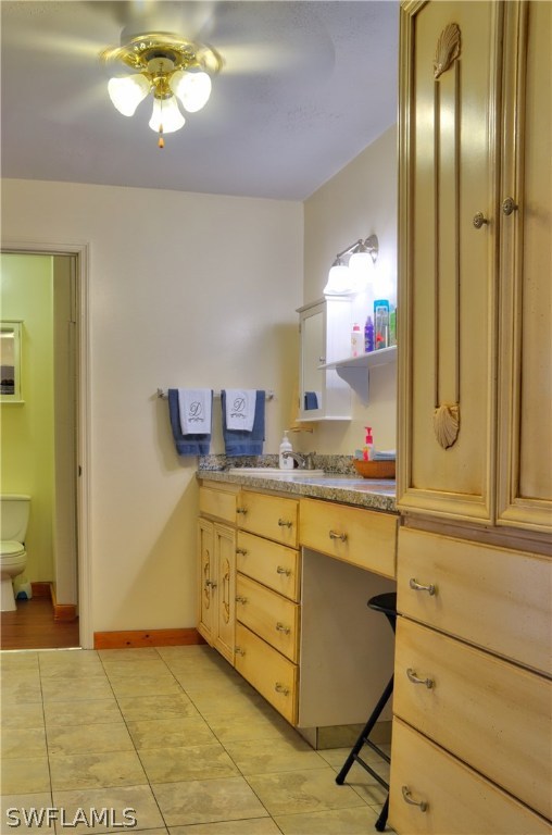 23081 North River Road Alva, FL 33920 - Photo 12 of 25 a bathroom with a sink a vanity and a mirror