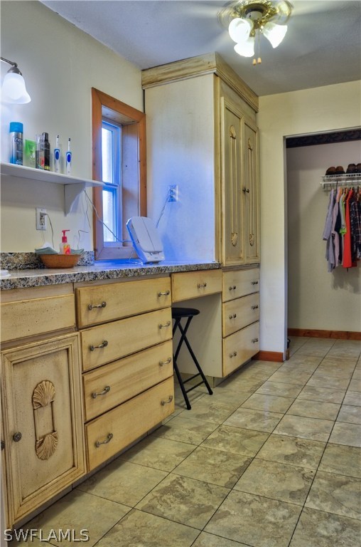 23081 North River Road Alva, FL 33920 - Photo 13 of 25 a room with cabinets and painting on the wall