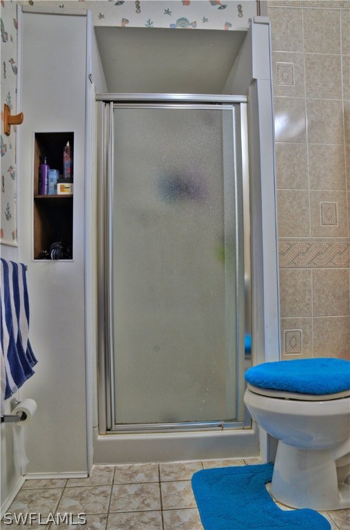 23081 North River Road Alva, FL 33920 - Photo 17 of 25 a bathroom with a toilet and a shower