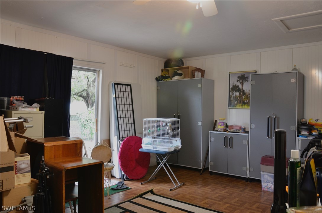 23081 North River Road Alva, FL 33920 - Photo 23 of 25 a room with furniture and wooden floor