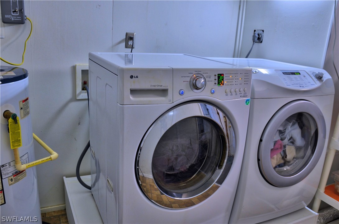 23081 North River Road Alva, FL 33920 - Photo 24 of 25 a utility room with dryer and washer